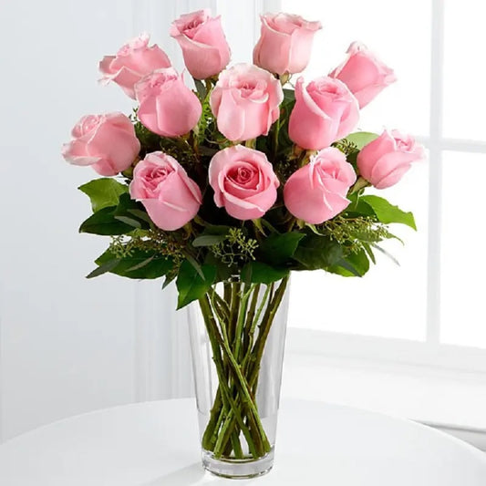 Fresh pink roses in glass vase for birthday anniversary and love gift