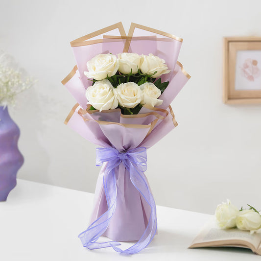10 fresh red roses bouquet in red and cream wrapping with ribbon