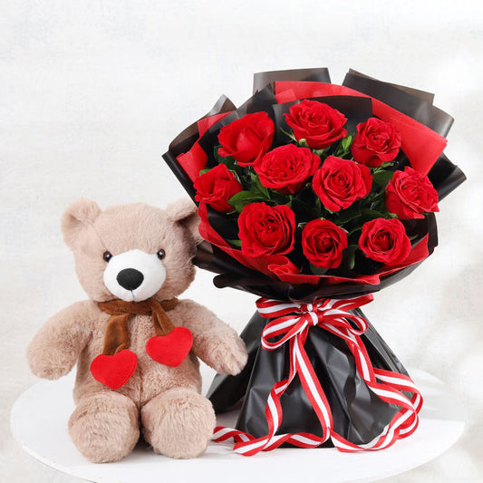Cute teddy bear with fresh red roses bouquet for birthday anniversary and romantic gift
